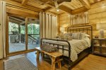 Queen size bedroom with 42` TV, deck access, and shared bathroom